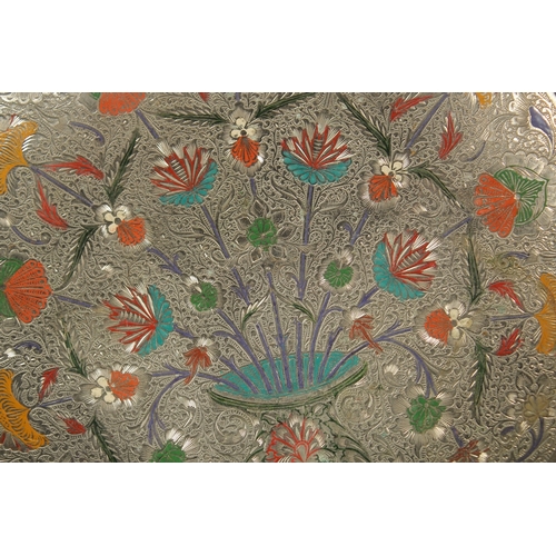 270 - AN INDIAN ENGRAVED AND ENAMELLED WHITE METAL FLORAL DISH, 29cm diameter.