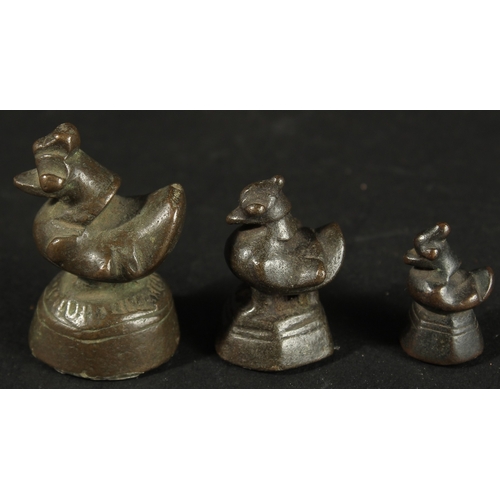 271 - THREE BURMESE GRADUATED BRONZE OPIUM WEIGHTS, (3).