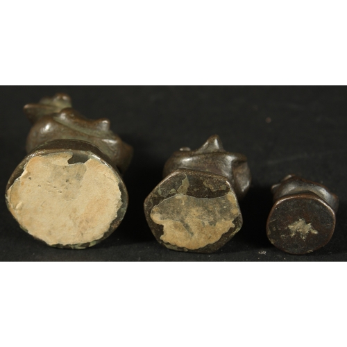 271 - THREE BURMESE GRADUATED BRONZE OPIUM WEIGHTS, (3).