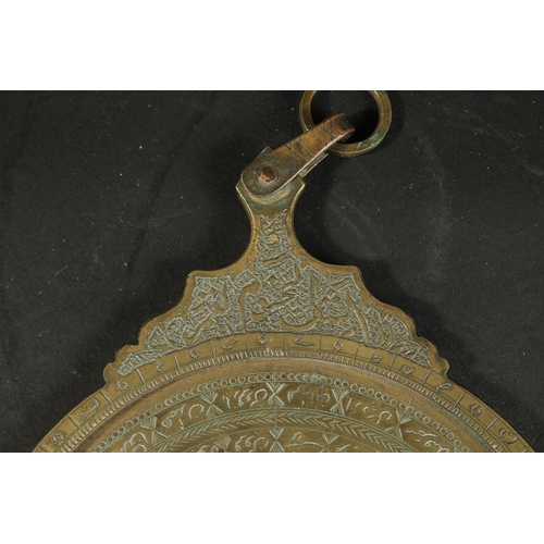 278 - AN ISLAMIC BRASS ASTROLABE, 23cm x 16cm.