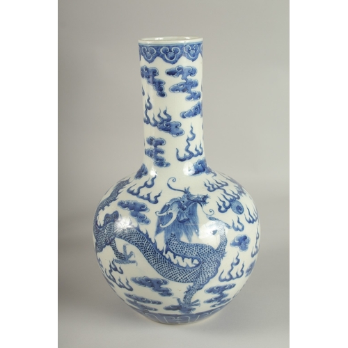 28 - A LARGE CHINESE BLUE AND WHITE PORCELAIN DRAGON VASE, the base with character mark, 36cm high.