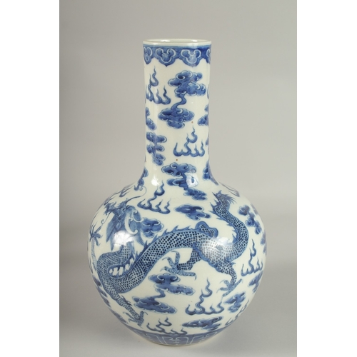 28 - A LARGE CHINESE BLUE AND WHITE PORCELAIN DRAGON VASE, the base with character mark, 36cm high.