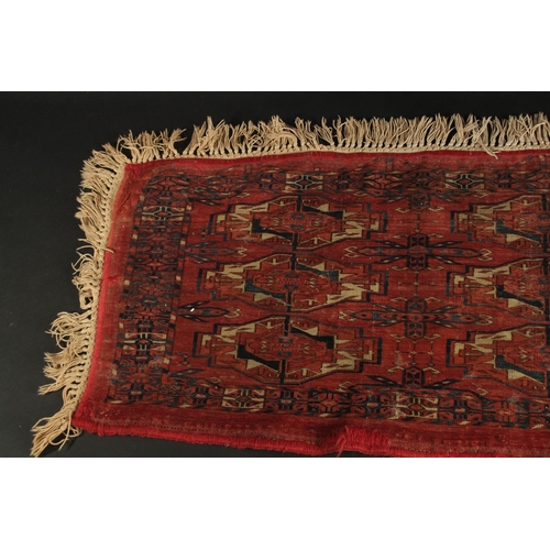 282 - A LATE 19TH CENTURY TEKKE RUG, 120cm x 46cm (excl. tassles).