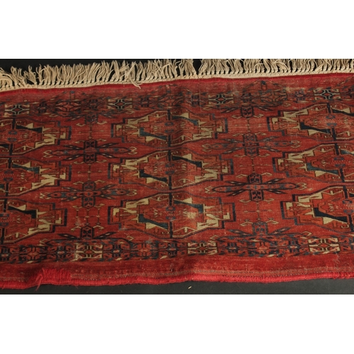 282 - A LATE 19TH CENTURY TEKKE RUG, 120cm x 46cm (excl. tassles).