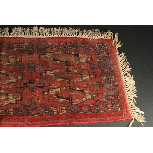 282 - A LATE 19TH CENTURY TEKKE RUG, 120cm x 46cm (excl. tassles).