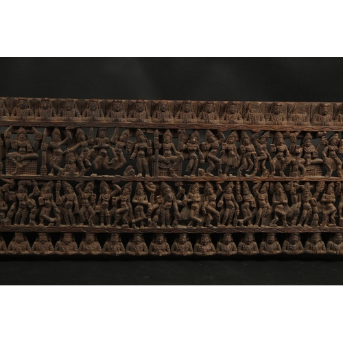 288 - A FINE LARGE 19TH CENTURY SOUTH INDIAN CARVED WOODEN PANEL, carved with rows of dancers. 97.5cm x 28... 