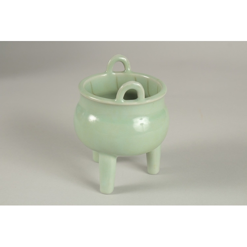 29 - A CHINESE CELADON GLAZE PORCELAIN TRIPOD CENSER, 13cm high.