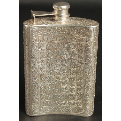 294 - A 19TH CENTURY INDIAN ENGRAVED SILVER FLASK, with fine floral designs, 13.5cm high.