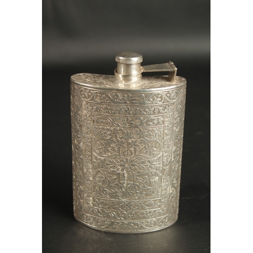 294 - A 19TH CENTURY INDIAN ENGRAVED SILVER FLASK, with fine floral designs, 13.5cm high.