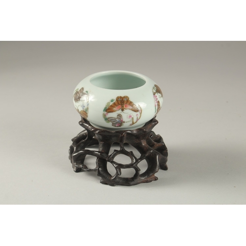 3 - A CHINESE PORCELAIN BOWL ON A CARVED HARDWOOD STAND, the bowl painted with butterflies and bearing s... 