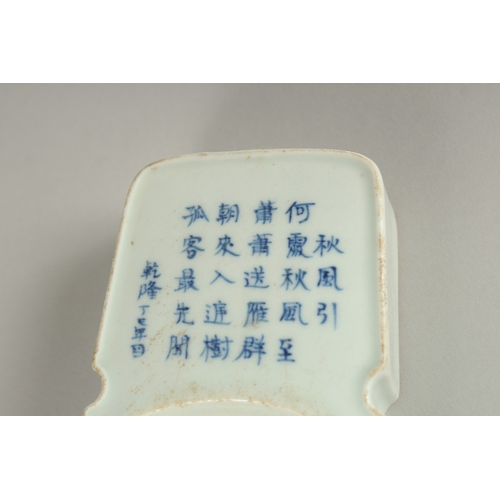 30 - A CHINESE PORCELAIN INKSTONE, with calligraphy inscriptions, 18.5cm long.