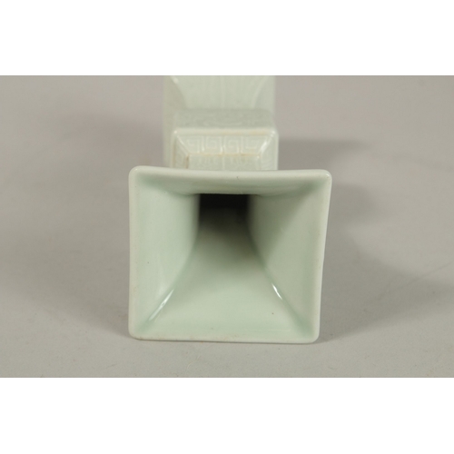 301 - A CHINESE CELADON MINIATURE PORCELAIN GU VASE, with six-character mark, 12.2cm high.