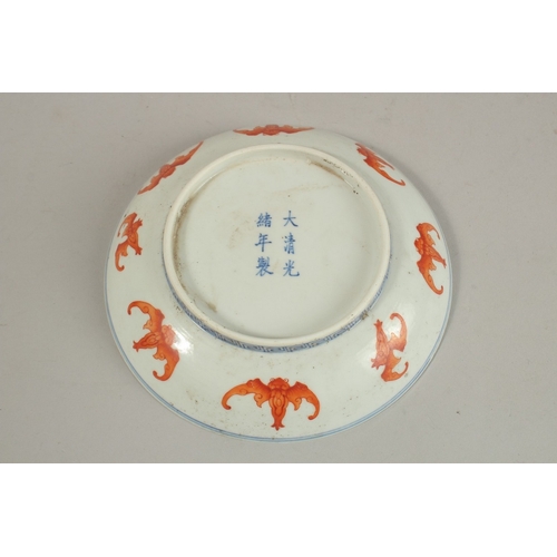 303 - A CHINESE BLUE AND WHITE WITH IRON RED PORCELAIN BAT DISH, with character mark to base, 15.5cm diame... 