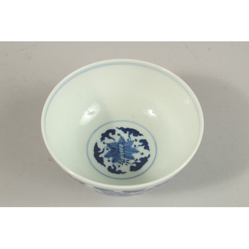 308 - A CHINESE BLUE AND WHITE PORCELAIN BOWL, with six-character mark, 12cm diameter.