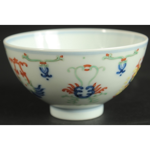 313 - A CHINESE DOUCAI PORCELAIN CUP, with six-character mark, 10cm diameter.