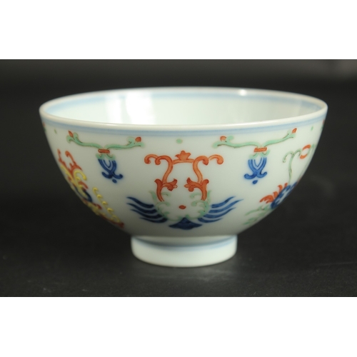 313 - A CHINESE DOUCAI PORCELAIN CUP, with six-character mark, 10cm diameter.