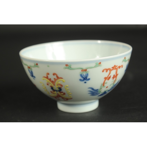 313 - A CHINESE DOUCAI PORCELAIN CUP, with six-character mark, 10cm diameter.