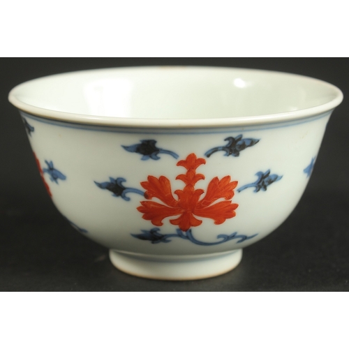 314 - A SMALL CHINESE BLUE AND WHITE PORCELAIN CUP, with character mark to base, 8cm diameter.