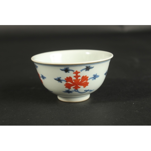 314 - A SMALL CHINESE BLUE AND WHITE PORCELAIN CUP, with character mark to base, 8cm diameter.