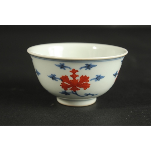 314 - A SMALL CHINESE BLUE AND WHITE PORCELAIN CUP, with character mark to base, 8cm diameter.