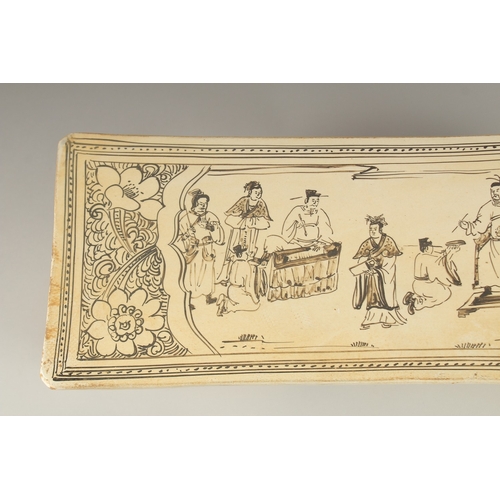 32 - A VERY LARGE CHINESE GLAZED POTTERY PILLOW, painted with figures and animals, 45cm long.