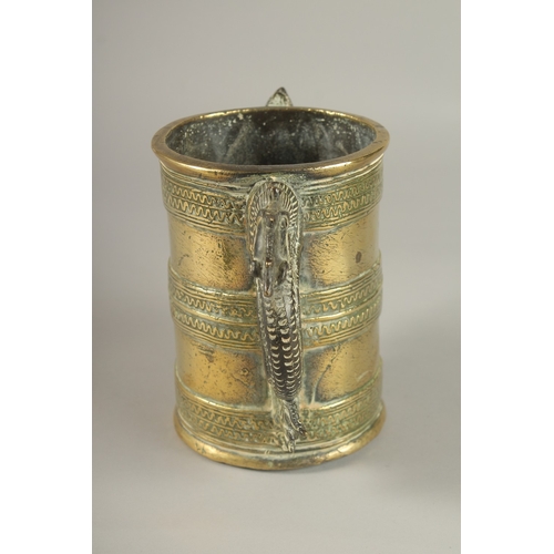 42 - AN UNUSAL GILT BRONZE TWIN HANDLE VESSEL, with strainer at the base, 15.5cm high.