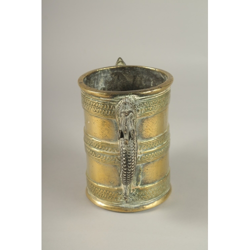 42 - AN UNUSAL GILT BRONZE TWIN HANDLE VESSEL, with strainer at the base, 15.5cm high.