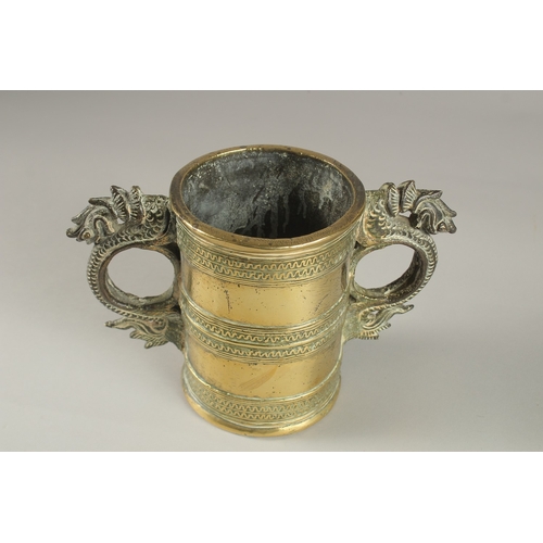 42 - AN UNUSAL GILT BRONZE TWIN HANDLE VESSEL, with strainer at the base, 15.5cm high.