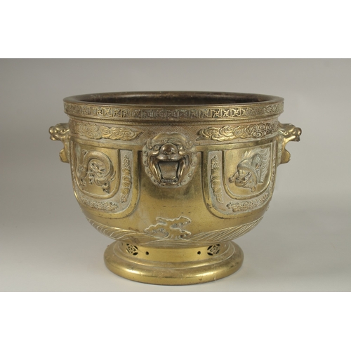 43 - A LARGE AND IMPRESSIVE GILT BRONZE JARDINIERE, with raised lion heads and panels depicting phoenix, ... 