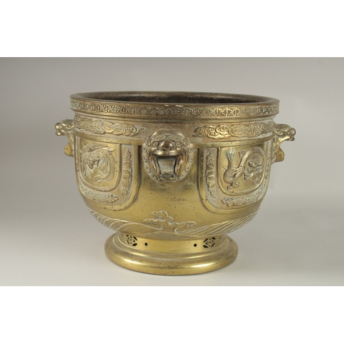 43 - A LARGE AND IMPRESSIVE GILT BRONZE JARDINIERE, with raised lion heads and panels depicting phoenix, ... 