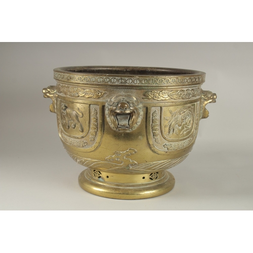 43 - A LARGE AND IMPRESSIVE GILT BRONZE JARDINIERE, with raised lion heads and panels depicting phoenix, ... 