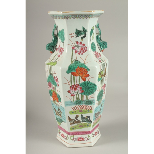 5 - A CHINESE FAMILLE ROSE PORCELAIN HEXAGONAL TWIN HANDLE VASE, 38.5cm high.