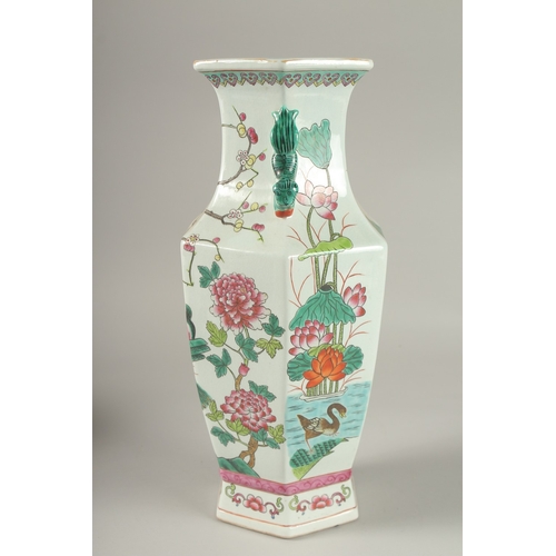 5 - A CHINESE FAMILLE ROSE PORCELAIN HEXAGONAL TWIN HANDLE VASE, 38.5cm high.