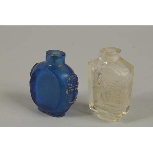 55 - A CHINESE REVERSE GLASS PAINTED SNUFF BOTTLE, together with a blue glass bottle, (2).