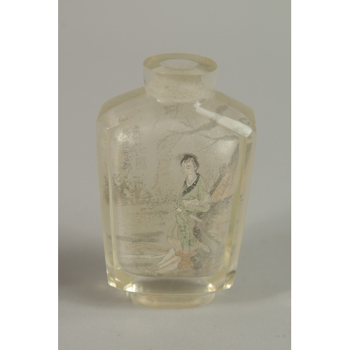 55 - A CHINESE REVERSE GLASS PAINTED SNUFF BOTTLE, together with a blue glass bottle, (2).