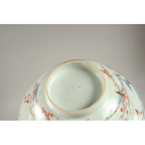 57 - A CHINESE PORCELAIN BOWL AND HARDWOOD STAND, (af), 19cm diameter.