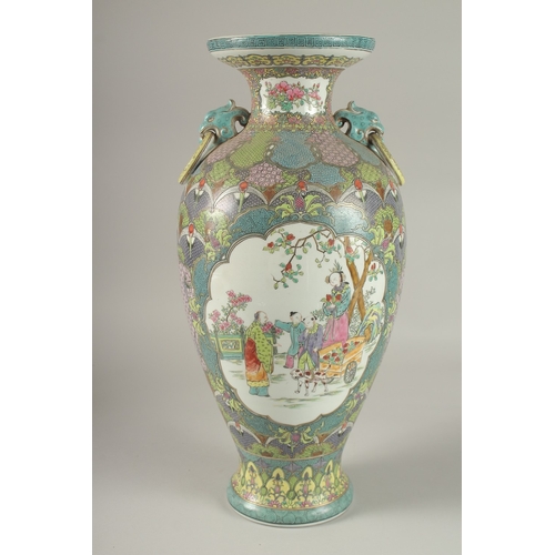 58 - A LARGE CHINESE POLYCHROME PORCELAIN TWIN HANDLE VASE, painted with panels of figures in outdoor set... 