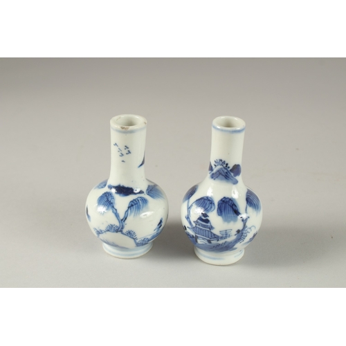 59 - A MINIATURE PAIR OF CHINESE BLUE AND WHITE PORCELAIN VASES, 8.5cm high.