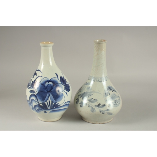 61 - TWO BLUE AND WHITE GLAZED PORCELAIN BOTTLES, 27cm high.