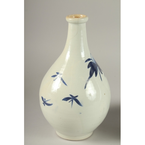 61 - TWO BLUE AND WHITE GLAZED PORCELAIN BOTTLES, 27cm high.