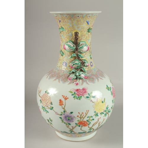 62 - A LARGE CHINESE FAMILLE ROSE PORCELAIN VASE, painted with exotic birds and flora, with moulded fruit... 