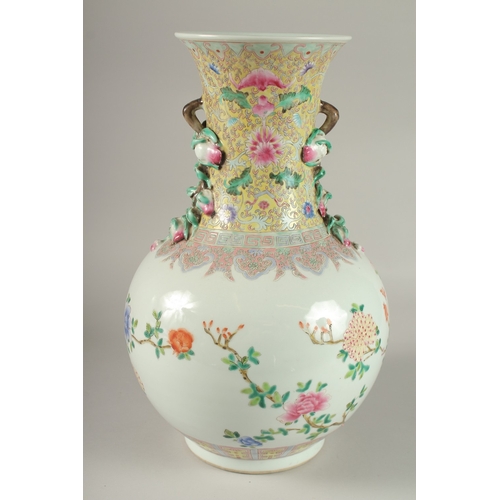 62 - A LARGE CHINESE FAMILLE ROSE PORCELAIN VASE, painted with exotic birds and flora, with moulded fruit... 