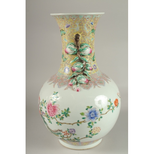 62 - A LARGE CHINESE FAMILLE ROSE PORCELAIN VASE, painted with exotic birds and flora, with moulded fruit... 