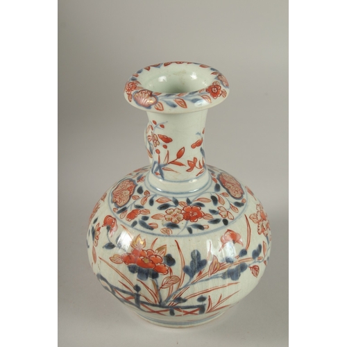 66 - A JAPANESE IMARI PORCELAIN KENDI, painted with pomegranate and flora with gilt highlights, 19.5cm hi... 