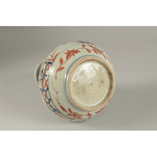 66 - A JAPANESE IMARI PORCELAIN KENDI, painted with pomegranate and flora with gilt highlights, 19.5cm hi... 