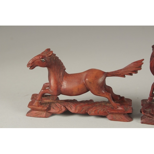 7 - A COLLECTION OF CARVED WOOD HORSES, with inlaid eyes, (6).