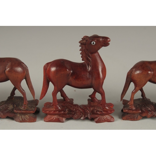 7 - A COLLECTION OF CARVED WOOD HORSES, with inlaid eyes, (6).