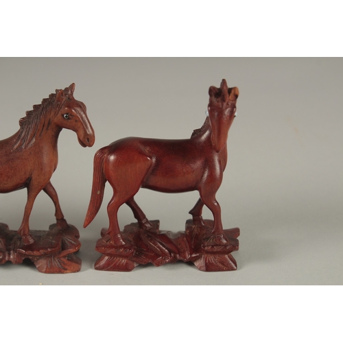 7 - A COLLECTION OF CARVED WOOD HORSES, with inlaid eyes, (6).