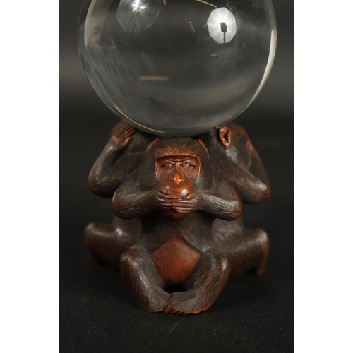 84 - A VERY FINE JAPANESE CARVED WOOD OKIMONO OF THREE WISE MONKEYS WITH GLASS BALL, in the manner of Mas... 