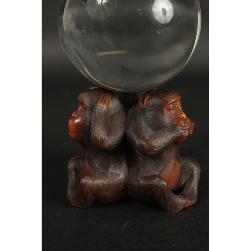 84 - A VERY FINE JAPANESE CARVED WOOD OKIMONO OF THREE WISE MONKEYS WITH GLASS BALL, in the manner of Mas... 